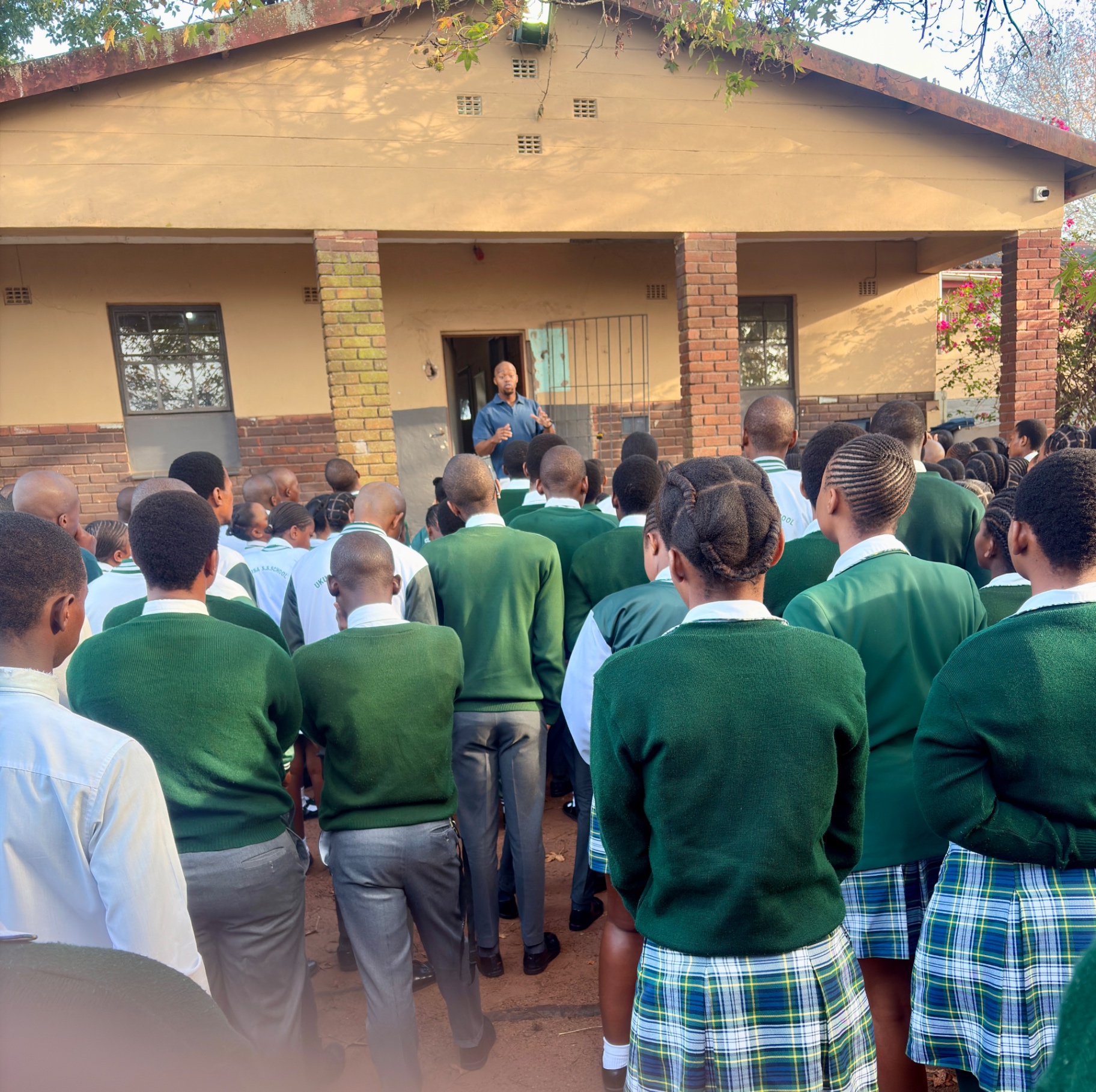 Founder speaking at school assembly